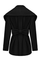 Black Victoria bow coat by Nana Jacqueline, shown from the back, featuring elegant bow details and tailored fit.