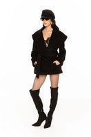 Black Victoria Bow Coat by Nana Jacqueline, stylish women's coat featuring a bow detail and tailored fit, shown on a model.
