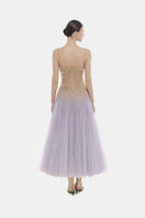 Violet ombre lace gown by Montsand featuring intricate lace details and a flowing midi-length design.