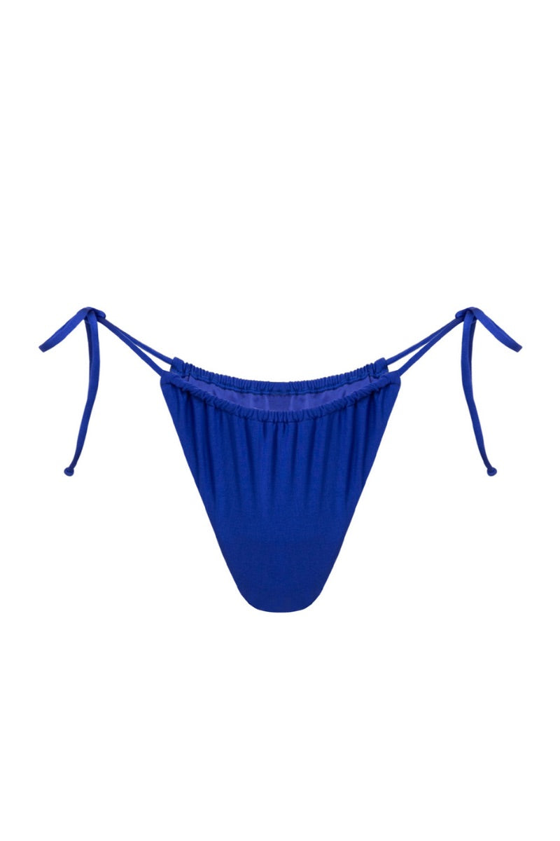 Deep blue satin bikini bottom by Suncillo, featuring a sleek, smooth fabric and stylish cut for a modern beach look.