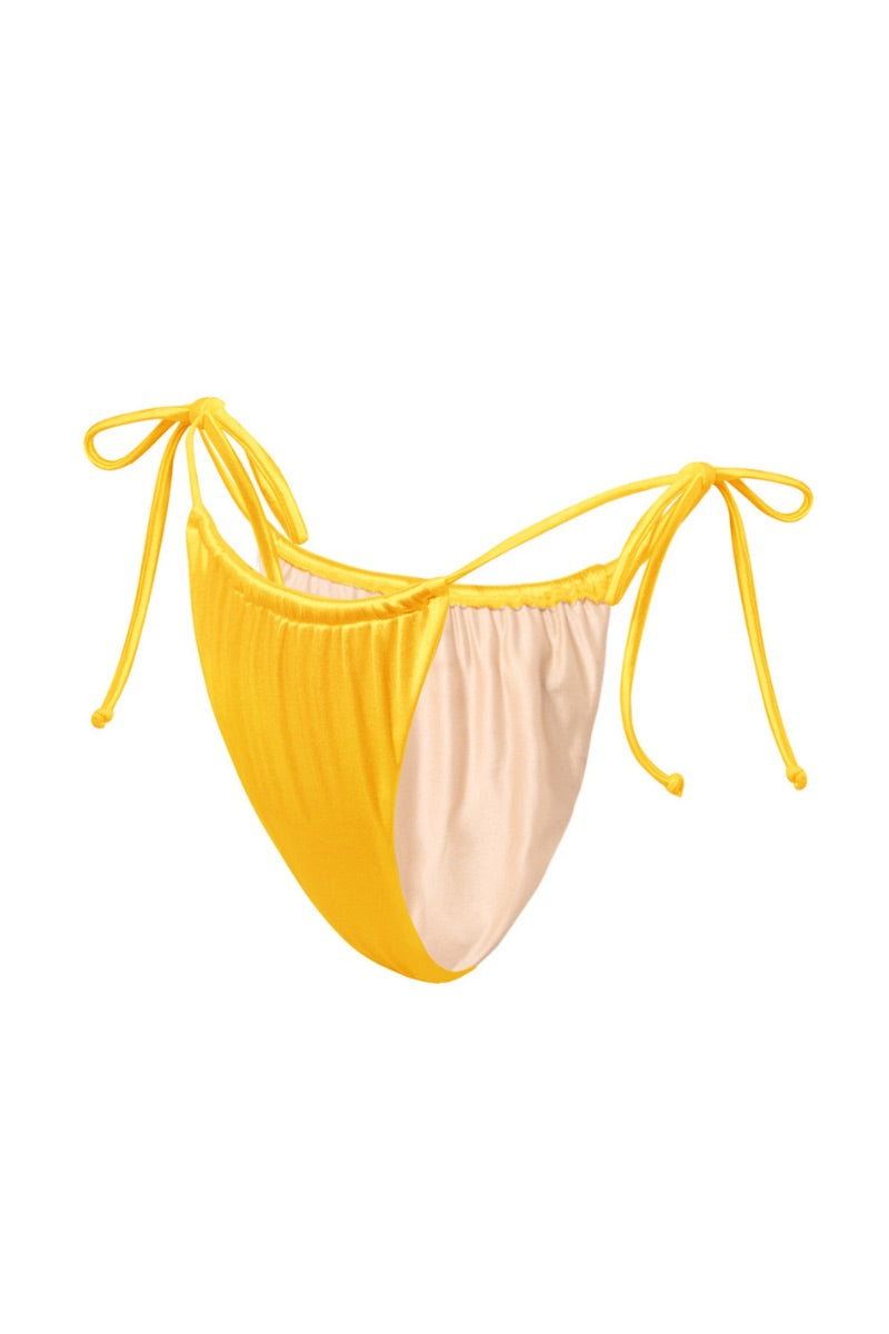 Yellow glossy bikini bottom by Suncillo from the Virna Sicily collection, featuring a sleek, shiny fabric design.