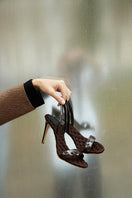 A pair of AERA Vivien brown patent-effect slingback sandals with open toes and block heels on a white background.