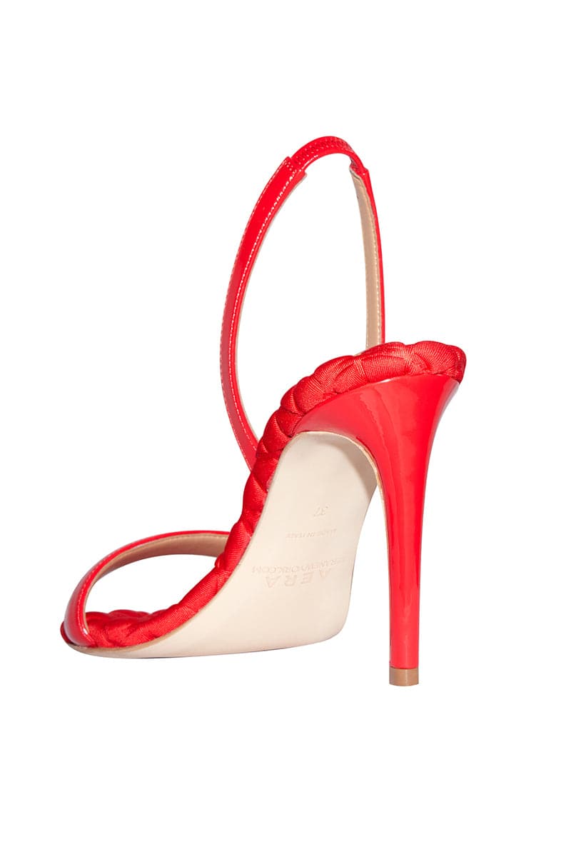 A pair of AERA Vivien red patent-effect slingback sandals with open toes and ankle straps on a neutral background.
