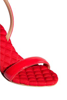 A pair of AERA Vivien red patent-effect slingback sandals with open toes and a sleek, shiny finish.