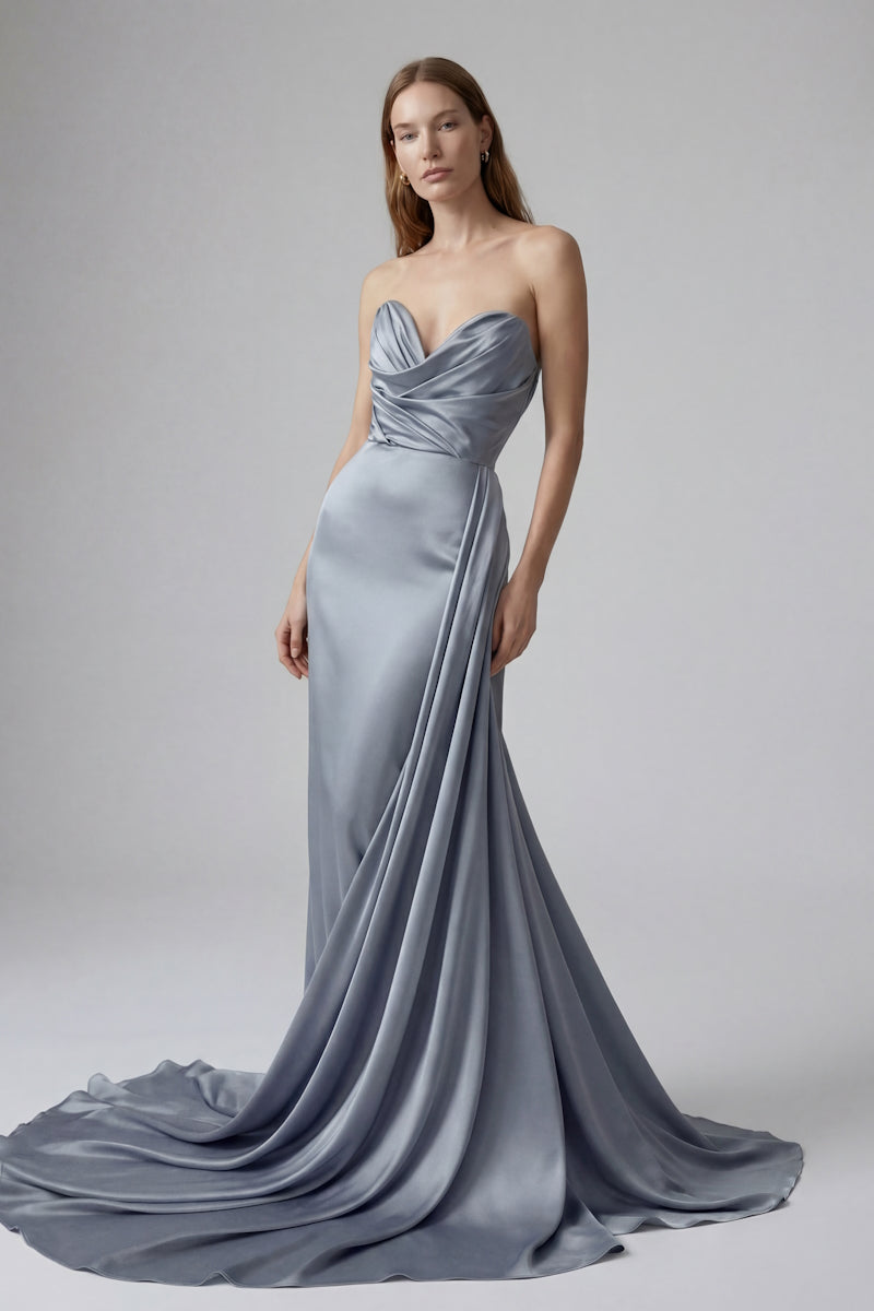 Elegant blue gown from Monetre, featuring a flowing design with intricate details, perfect for formal occasions.