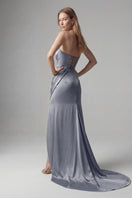 Elegant blue gown from Monetre, featuring a flowing design and sophisticated style, perfect for formal occasions.