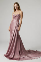 Elegant rose-colored gown by Monetre, featuring a flowing design with intricate details, perfect for formal occasions.