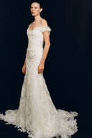Elegant Monetre Fleur Antique gown featuring intricate lace and vintage-inspired design, displayed on a mannequin.