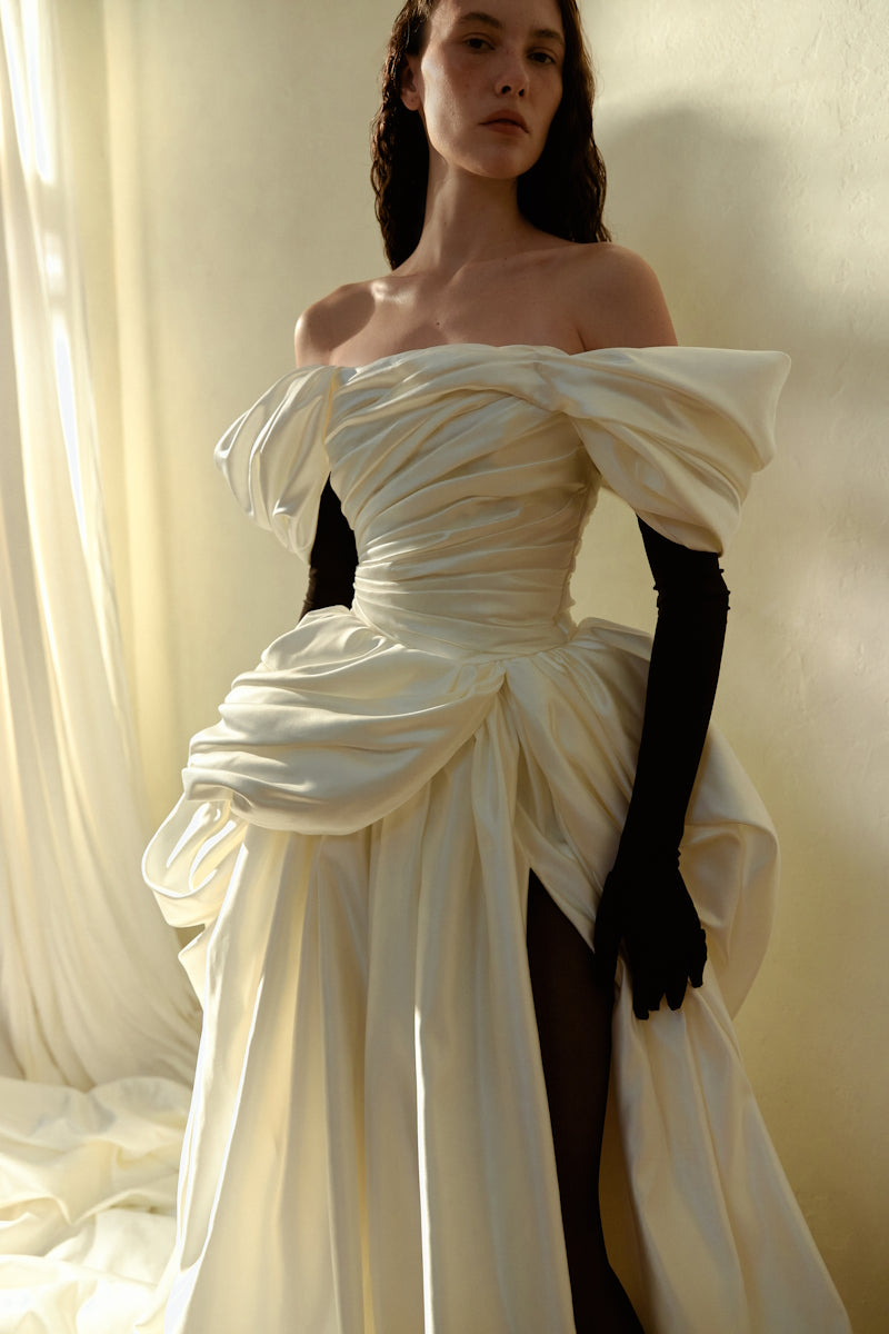 Elegant Venera Blanche gown by Monetre, featuring flowing fabric and intricate detailing, ideal for formal occasions.