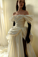 Elegant Venera Blanche gown by Monetre, featuring flowing fabric and intricate detailing, ideal for formal occasions.