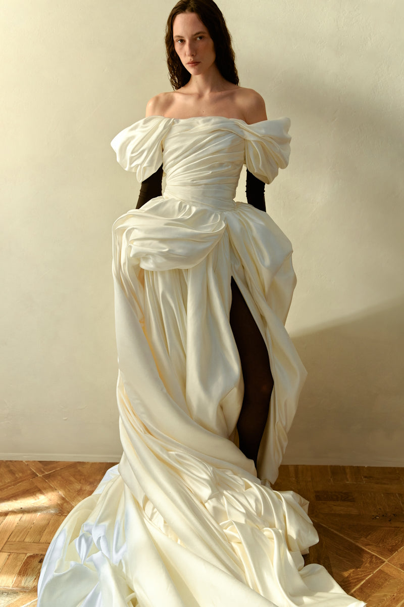 Elegant VENERA BLANCHE gown by Monetre featuring flowing fabric and intricate detailing, perfect for formal occasions.