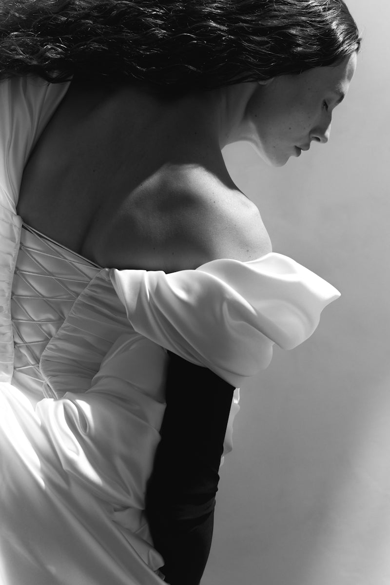 Elegant Venera Blanche gown by Monetre featuring flowing fabric and intricate detailing, perfect for formal occasions.