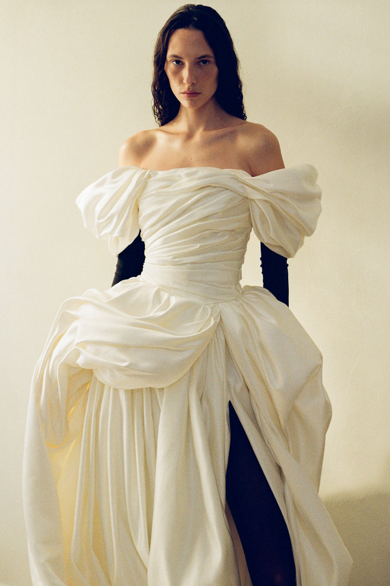 Elegant Venera Blanche gown by Monetre featuring flowing fabric and intricate detailing, perfect for formal occasions.