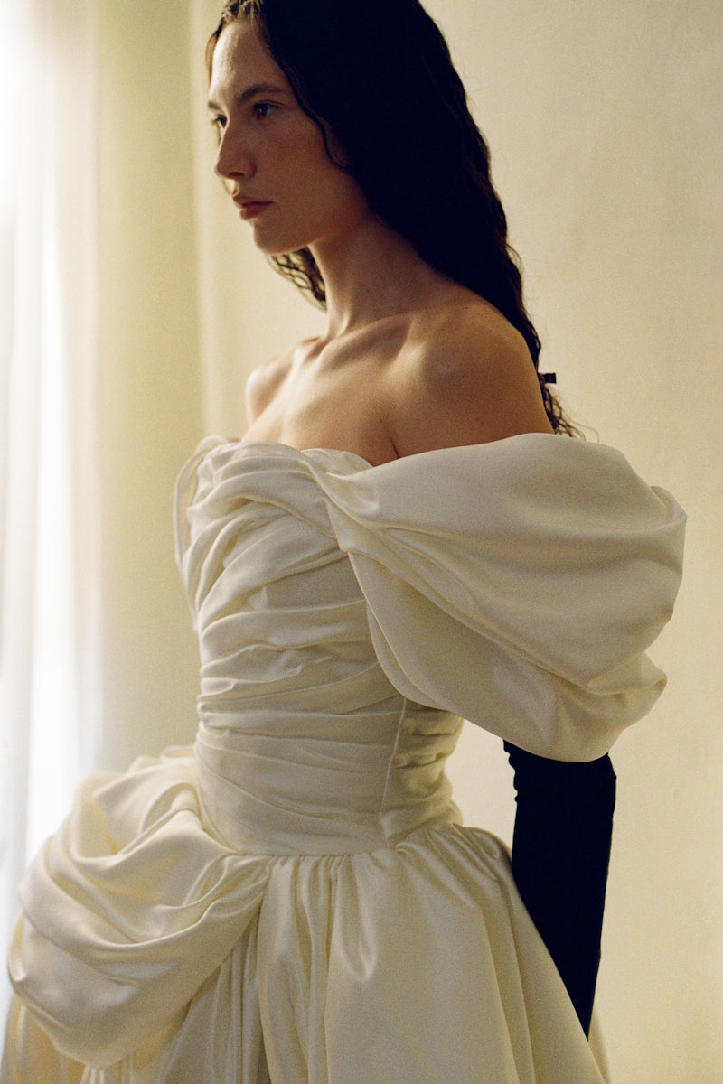 Elegant Venera Blanche gown by Monetre featuring flowing fabric and intricate design, perfect for formal occasions.