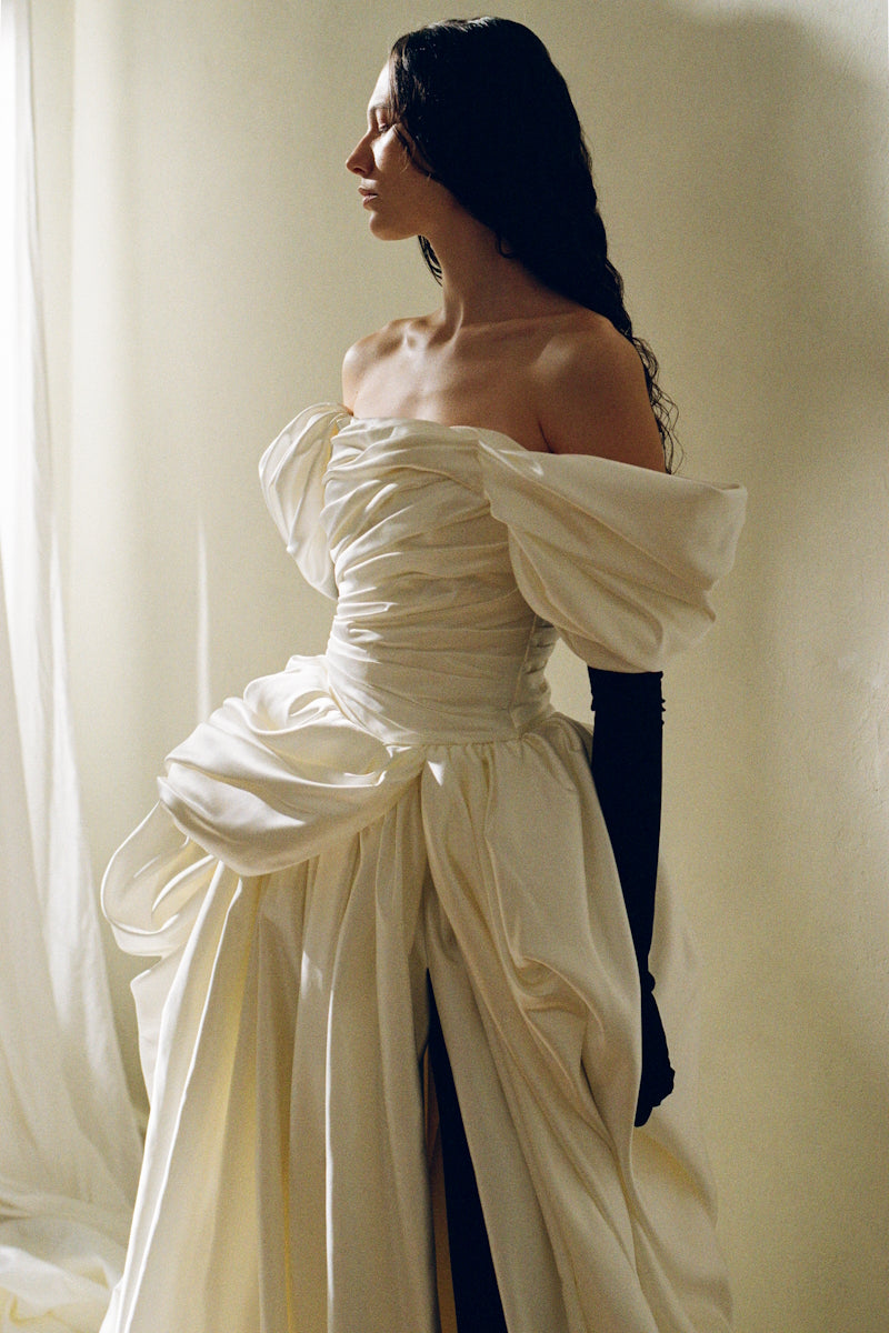 Elegant Venera Blanche gown by Monetre featuring flowing fabric and intricate detailing, perfect for formal occasions