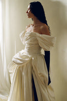 Elegant Venera Blanche gown by Monetre featuring flowing fabric and intricate detailing, perfect for formal occasions