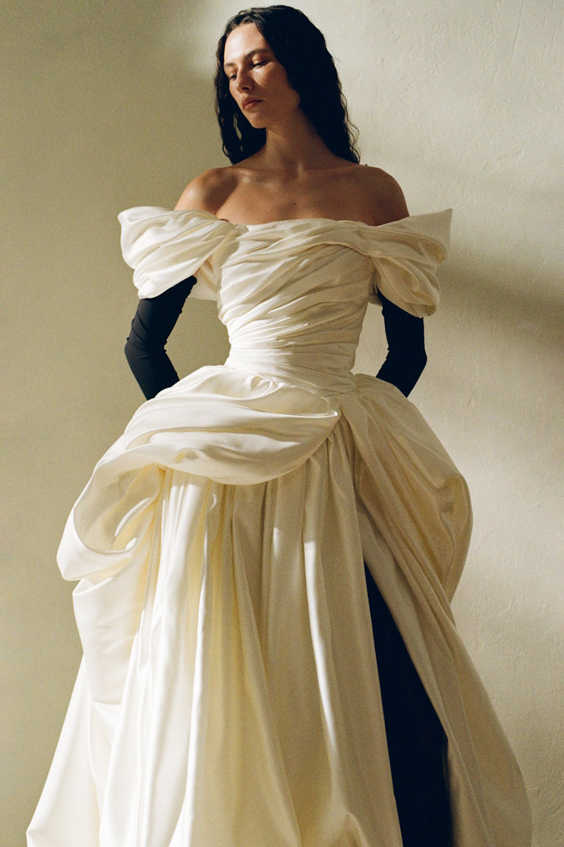 Elegant Venera Blanche gown by Monetre featuring flowing fabric and intricate detailing, perfect for formal occasions.