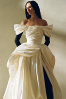 Elegant Venera Blanche gown by Monetre featuring flowing fabric and intricate detailing, perfect for formal occasions.