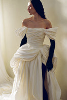 Elegant Venera Blanche gown by Monetre featuring flowing fabric and intricate detailing, perfect for formal occasions.