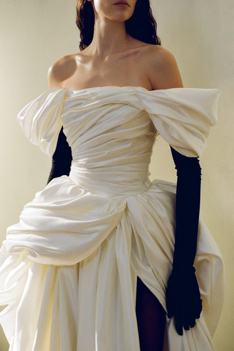 Elegant Venera Blanche gown by Monetre featuring flowing fabric and intricate detailing, perfect for formal occasions.