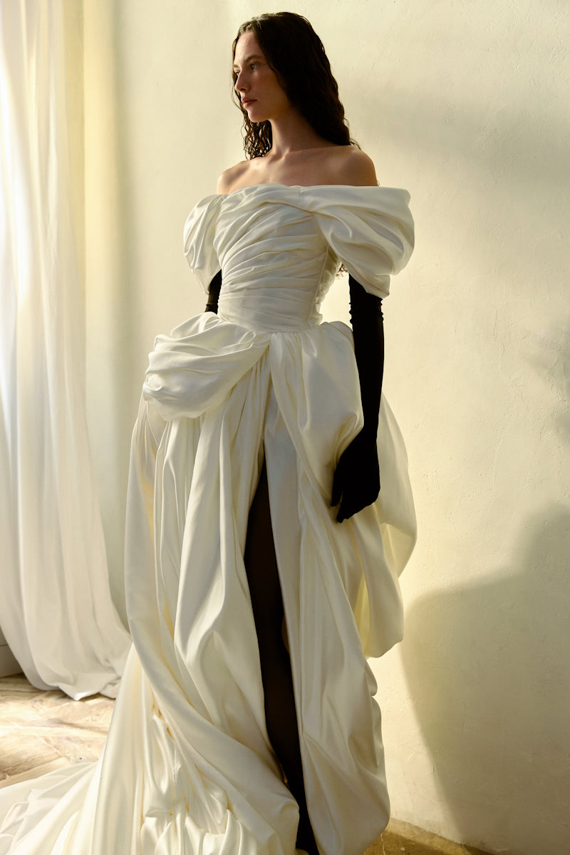 Elegant Venera Blanche gown by Monetre featuring flowing fabric and intricate detailing, perfect for formal occasions.