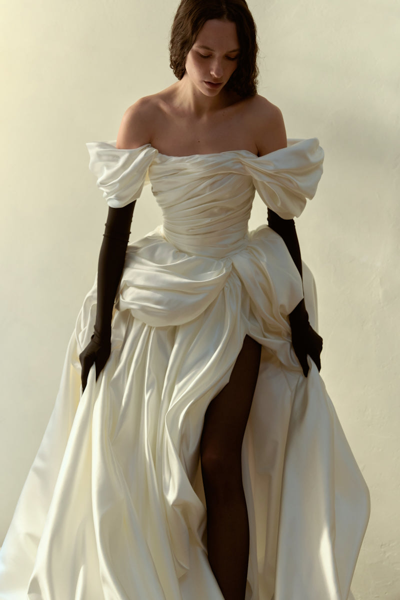 Elegant Venera Blanche gown by Monetre, featuring flowing fabric and intricate detailing, perfect for formal occasions.