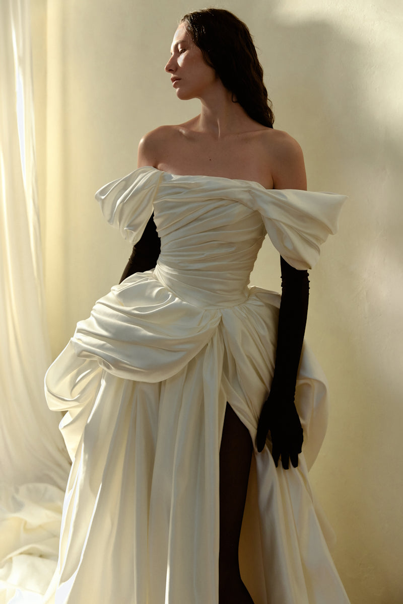 Elegant Venera Blanche gown by Monetre featuring flowing fabric and intricate details, perfect for formal occasions.