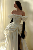 Elegant Venera Blanche gown by Monetre featuring flowing fabric and intricate details, perfect for formal occasions.