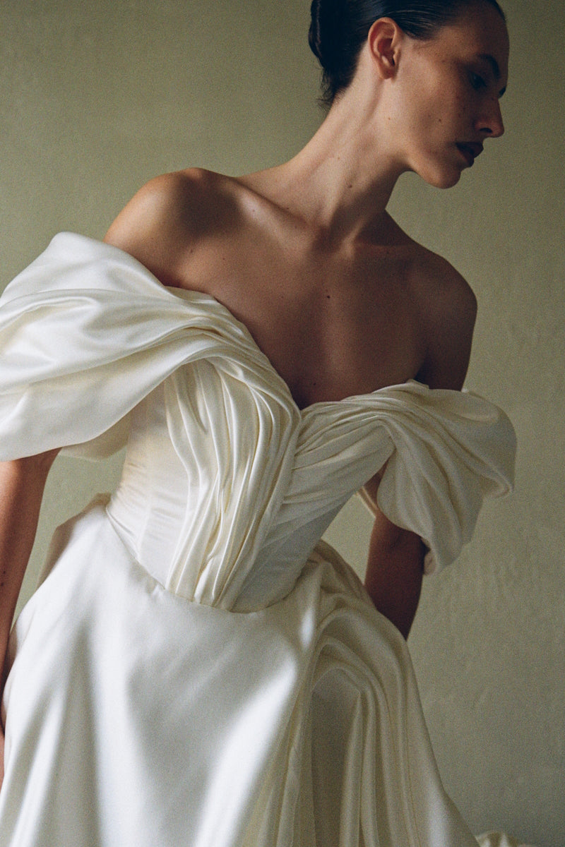 Elegant Monetre Grace Gown with intricate lace detailing, flowing fabric, and a sophisticated silhouette for formal occasions.