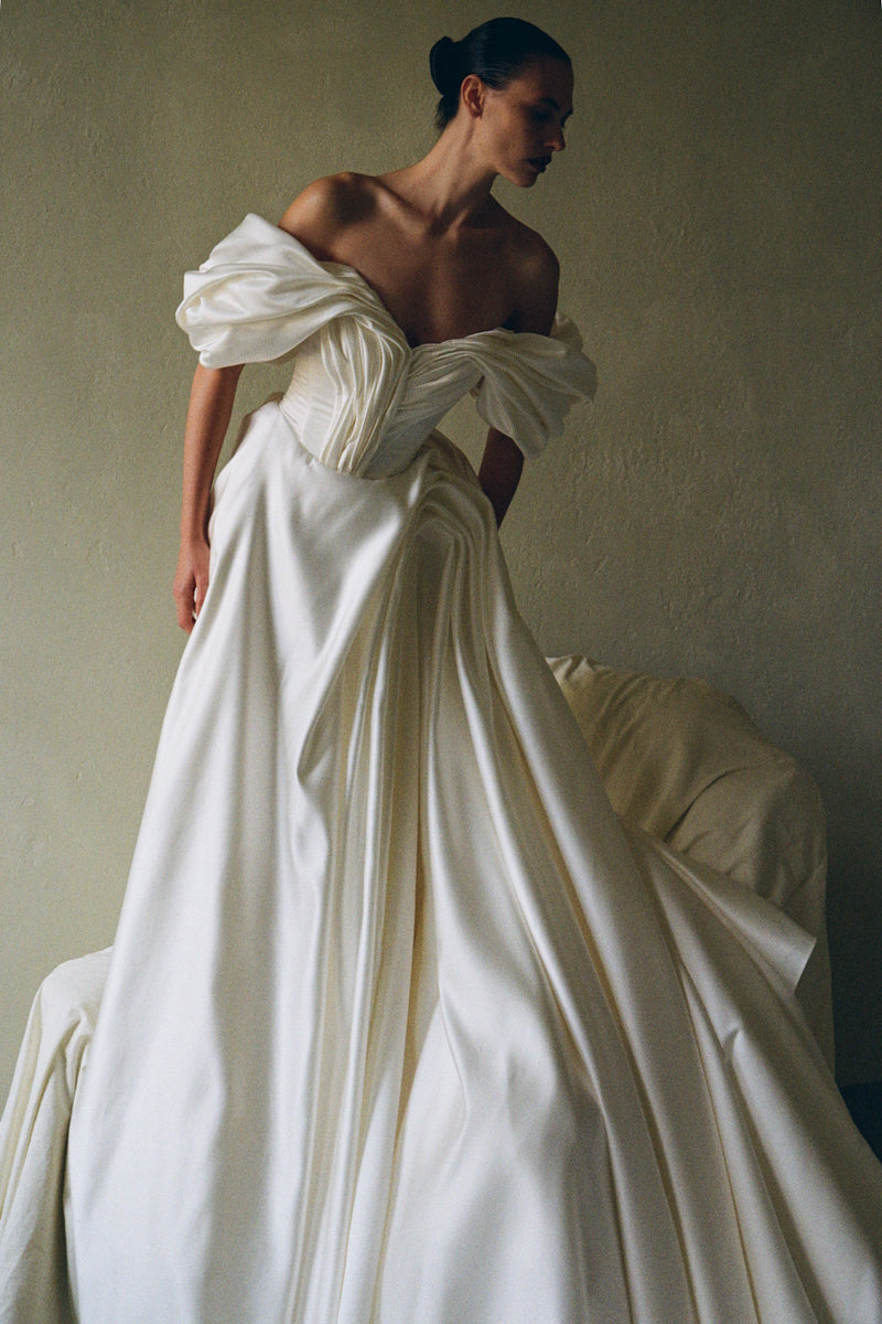 Elegant Monetre Grace Gown with flowing fabric and detailed design, perfect for formal occasions.