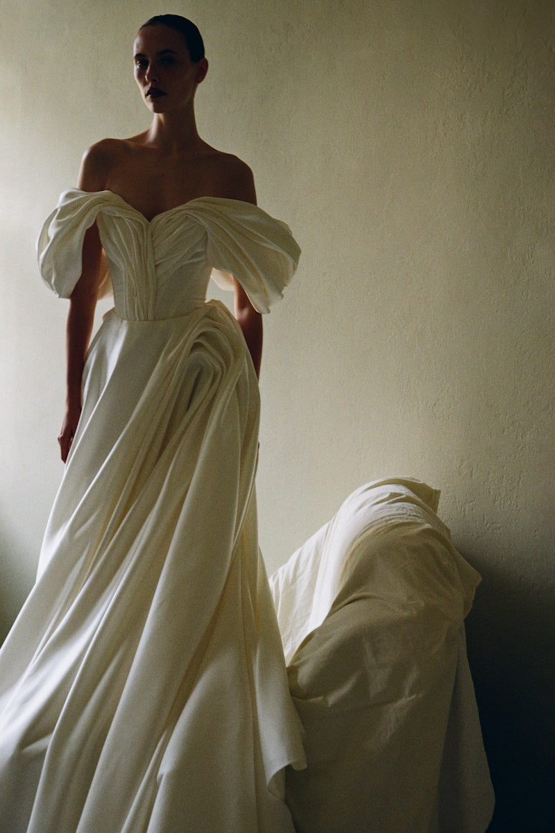 Elegant Monetre Grace gown in soft fabric, featuring intricate design details perfect for formal occasions.
