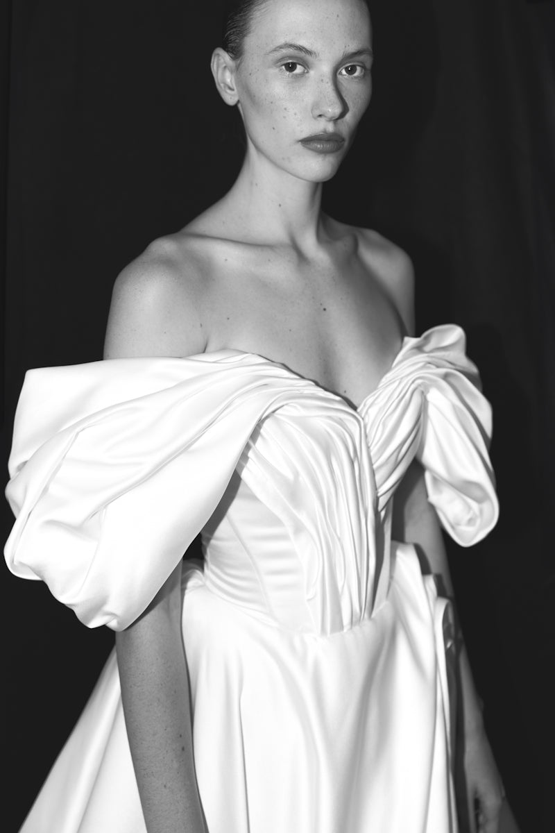 Elegant Monetre Grace gown with flowing fabric and intricate details, showcased in a stylish full-length view.