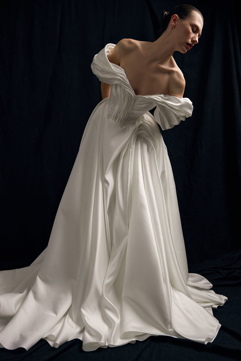 Elegant Monetre Grace Gown in soft fabric with intricate detailing, perfect for formal occasions.