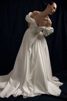 Elegant Monetre Grace Gown in soft fabric with intricate detailing, perfect for formal occasions.