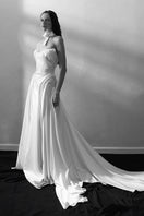 Elegant Monetre Luna gown in soft fabric with flowing design, showcased in a stylish full-length shot.