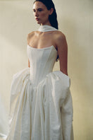 Elegant Vesna Gown by Monetre featuring flowing fabric and intricate detailing, perfect for formal occasions.