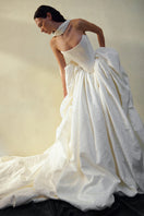 Elegant Vesna gown by Monetre featuring flowing fabric and intricate detailing, perfect for formal occasions.