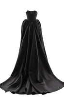 Elegant black Eterna gown by Monetre, featuring flowing fabric and stylish design, ideal for formal occasions.