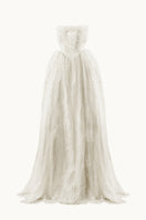 Elegant pale gown from Monetre's Agness collection featuring flowing fabric and sophisticated design.