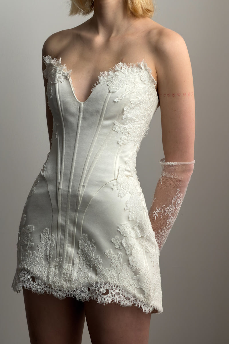 Elegant Monetre Serena Nuance gown featuring intricate lace details and flowing fabric in a soft, sophisticated style.