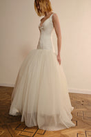 Elegant Monetre Alaya Measure Gown with intricate design, flowing fabric, and detailed craftsmanship perfect for formal occasions.