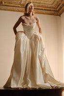 Elegant Monetre Elzabeth Diptych gown with intricate detailing, flowing fabric, and a sophisticated design suitable for formal occasions.