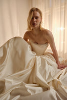 Elegant ELZABETH Diptych gown by Monetre, featuring flowing fabric and intricate design details in a sophisticated evening gown.