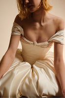 Elegant Monetre Elzabeth Diptych gown in soft fabric, featuring intricate detailing and a flowing silhouette.
