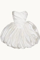 Elegant Lilith Petal gown by Monetre featuring floral petal details and flowing fabric, displayed on a mannequin.