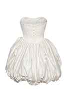 Off-white Lilith Petal gown by Monetre featuring delicate petal details and elegant flowing fabric.