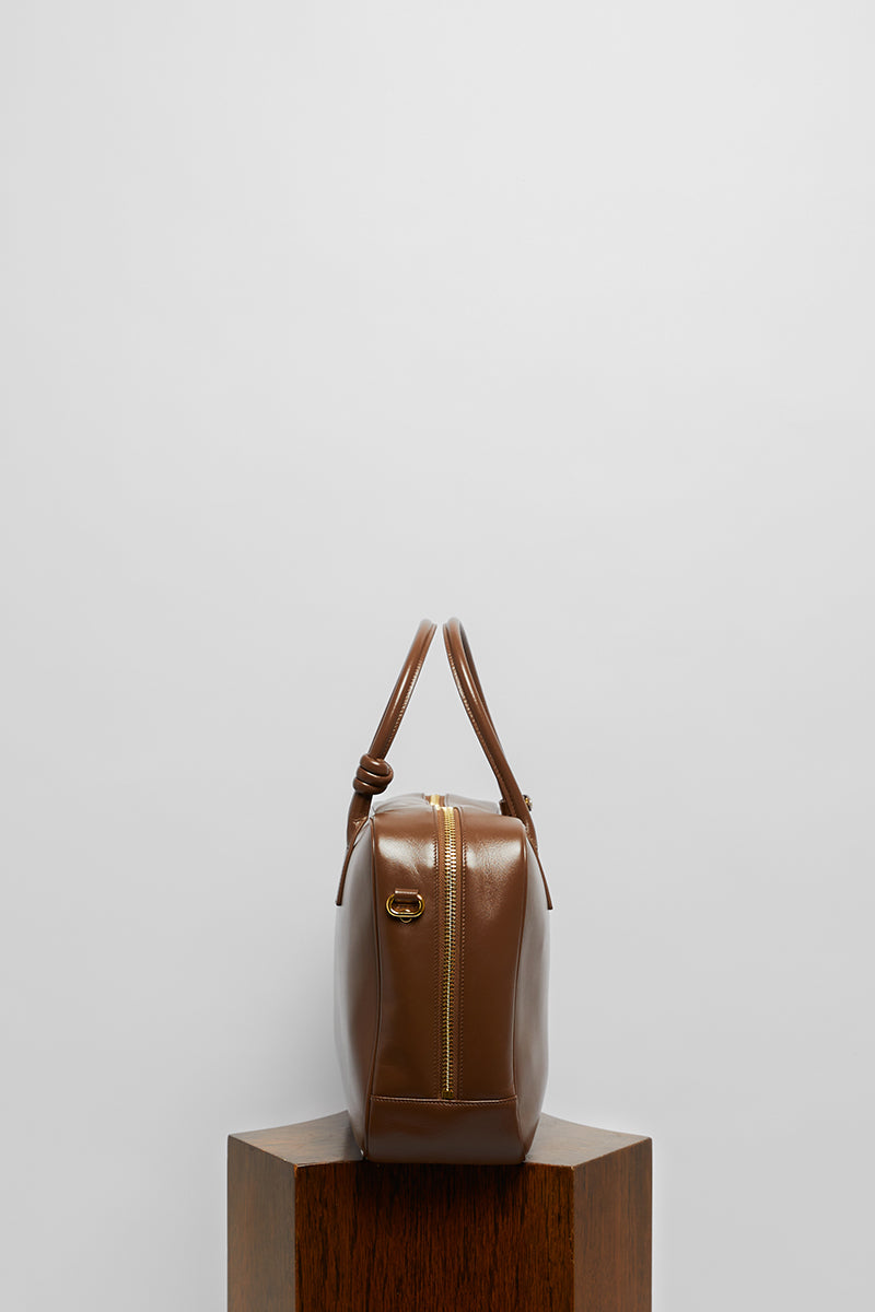 Leather work bag in mocha color with top handle, stylish and practical by FolkLore The Label.