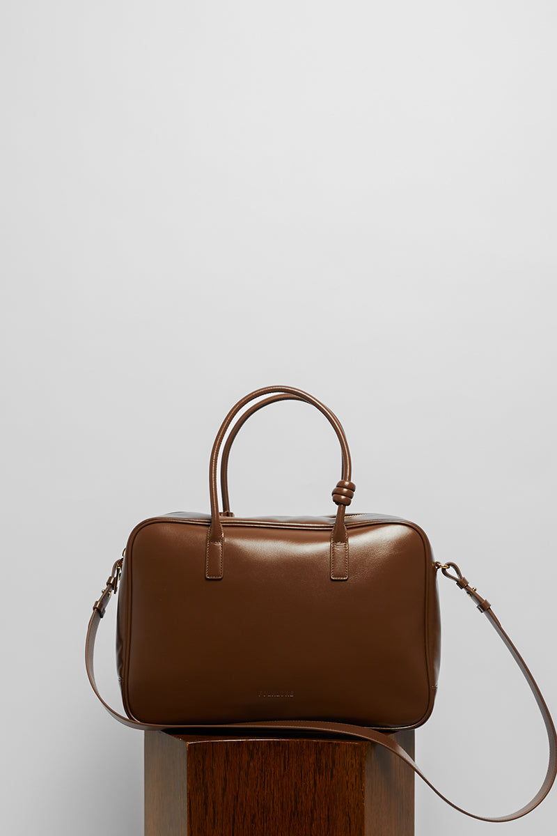 Leather work bag in mocha color with top handle, stylish and functional, from Folklore The Label.