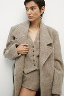 JC Pajares virgin wool coat in classic design, featuring a tailored fit and warm fabric, perfect for cold weather.