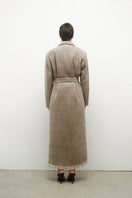 Elegant JC Pajares virgin wool coat displayed on a hanger, showcasing its classic design and tailored fit.